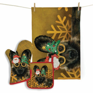 A gold coloured Christmas-themed kitchen set with golden snowflakes, and a hyena wearing festive glitter glasses that have a Christmas tree and a Santa Claus on them. There is a pot holder, an oven glove and a tea towel in the set.