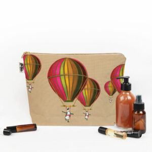 Muted Pink Penguin in Flight Toiletry Bag